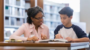 Tutor working with middle school student