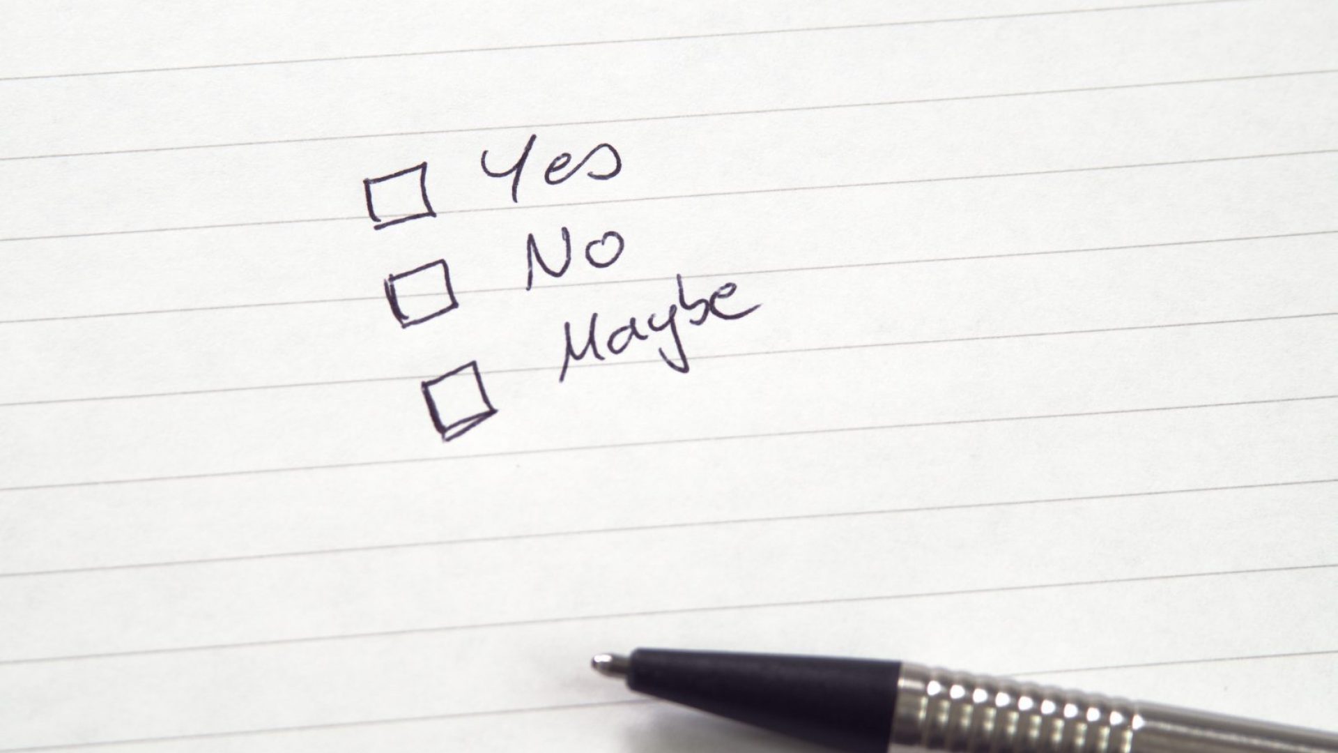 Checkboxes for Yes, No, Maybe in handwriting on lined paper with pen