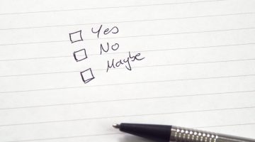 Checkboxes for Yes, No, Maybe in handwriting on lined paper with pen