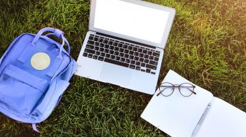 Laptop,notebook and eye glasses.