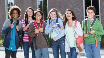 Students standing outside building