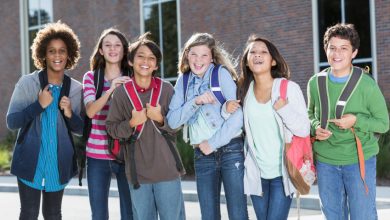 Students standing outside building