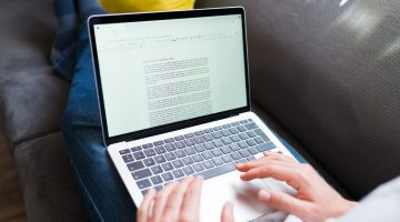 Person working on a report at home